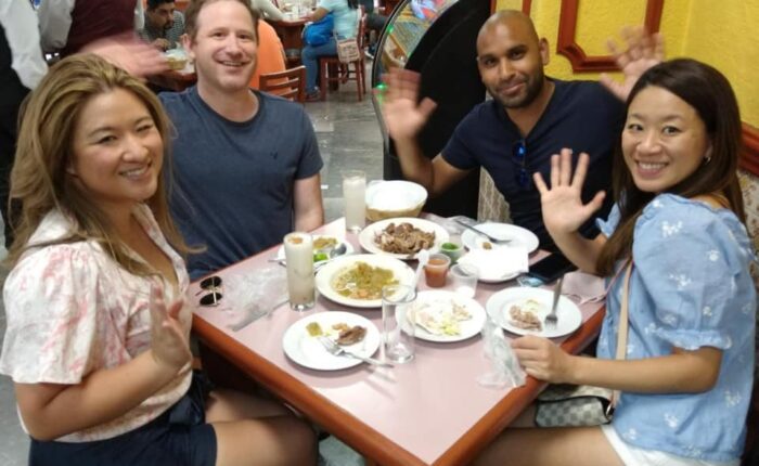 a group of people sitting at a table in a restaurant