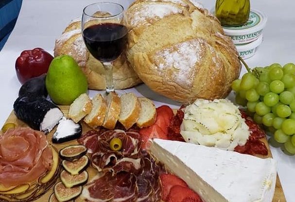 a table topped with different types of food on a plate