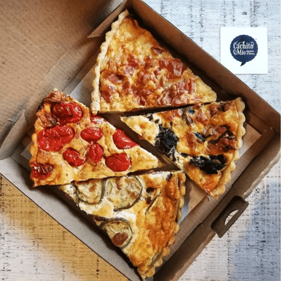 a slice of pizza sitting on top of a wooden table