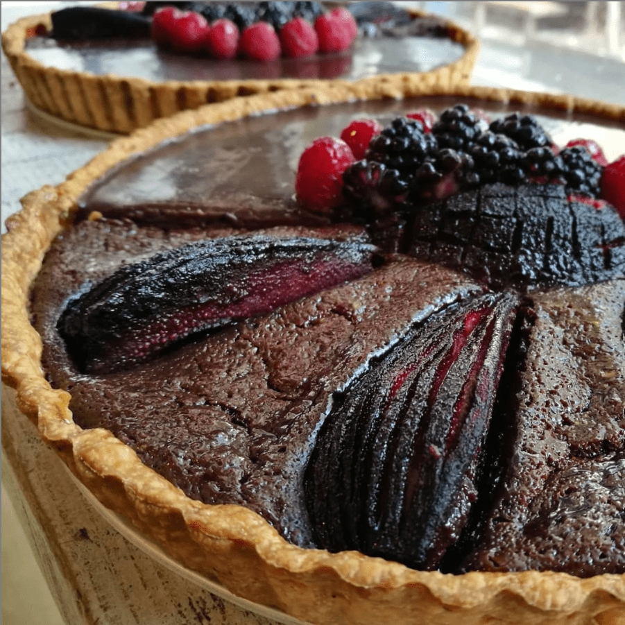 a close up of a plate of food with a slice of cake