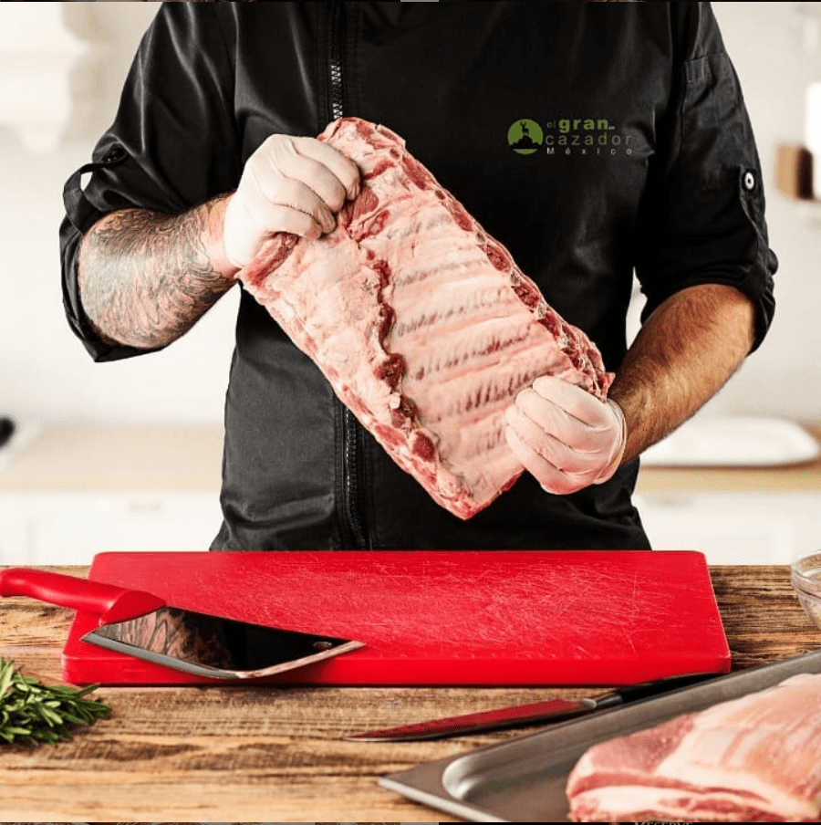 a man holding a rack of ribs